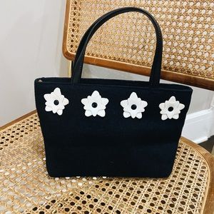 Vintage black handbag with flower embellishments! 🌸
